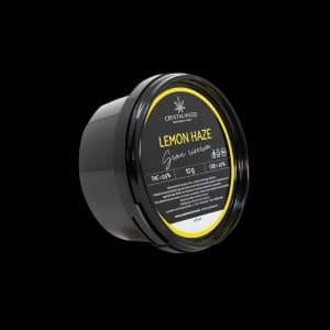 Barattolo Crystalweed “Lemon Haze” da 10 g per infiorescenza CBD su sfondo nero.